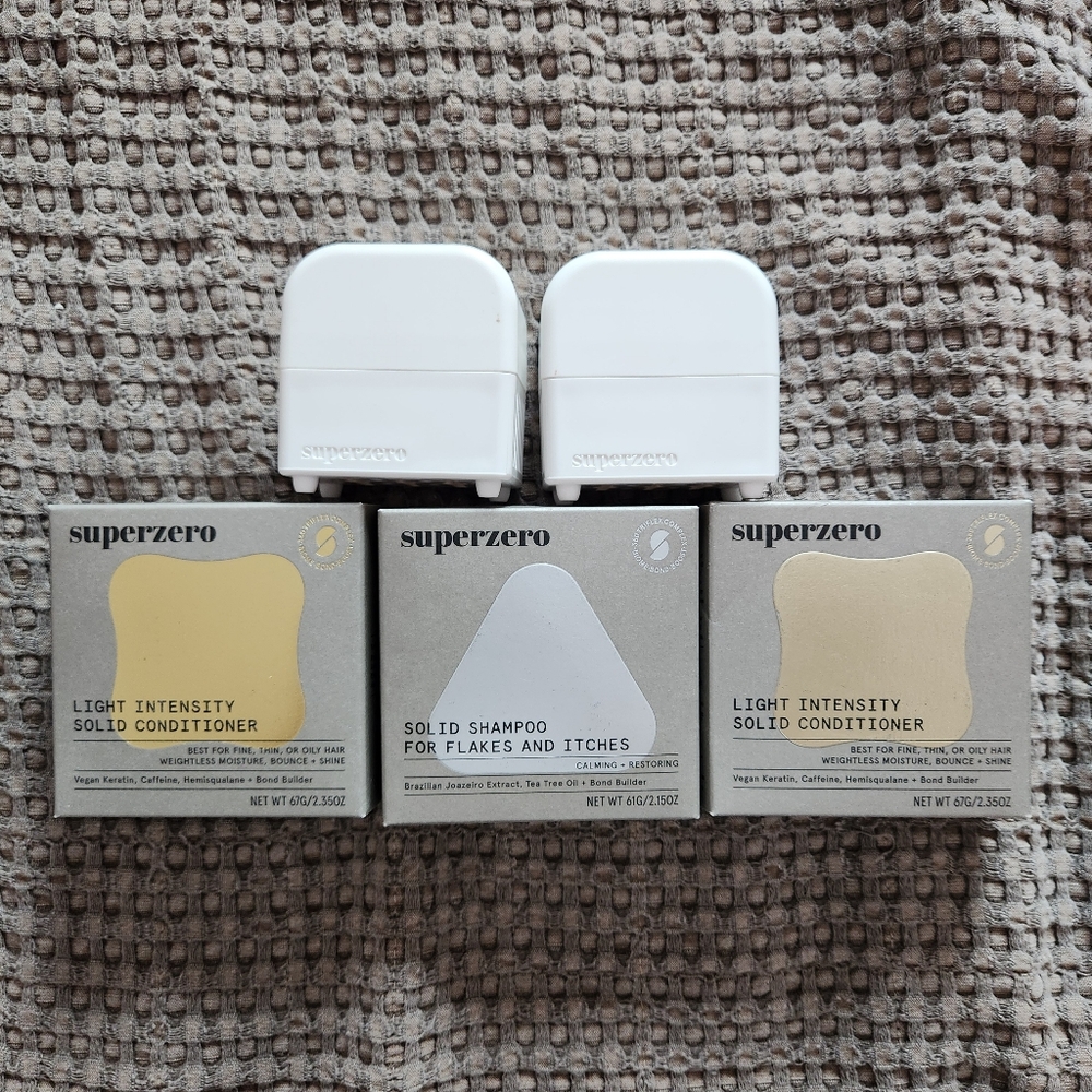 SuperZero shampoo, conditioner, and travel cases